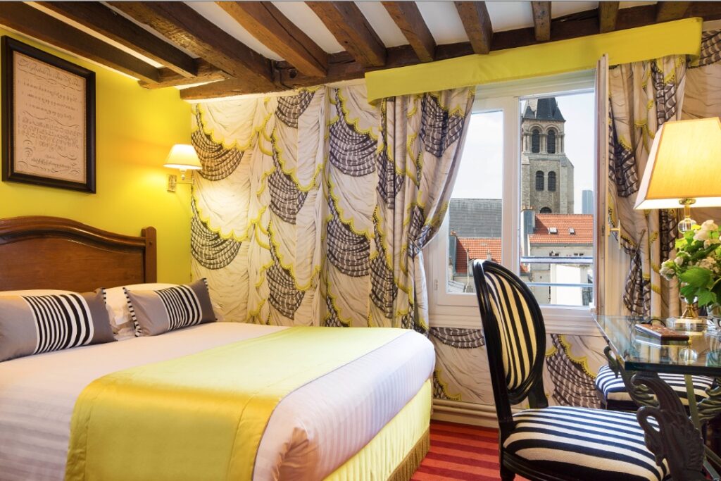 superior garden room with a view over the church bel of saint-germain-des-prés at hotel des marronniers in Paris center - hotel for Valentine's Day in Paris
