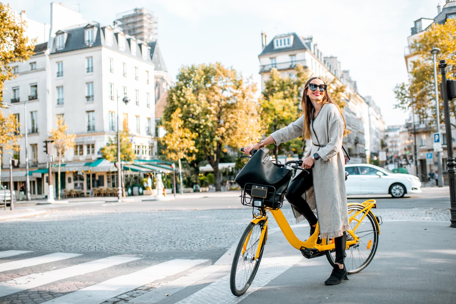 woman on a bike in Paris - Paris France hotel des marronniers