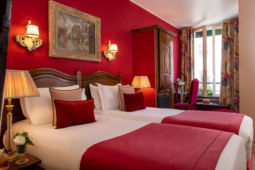 room with 2 beds, pink fabrics, pink pillows and window - boutique hotel Paris rooms - hotel des marronniers