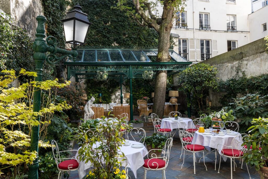 garden for an afternoon tea in Paris - tables, chairs, cups