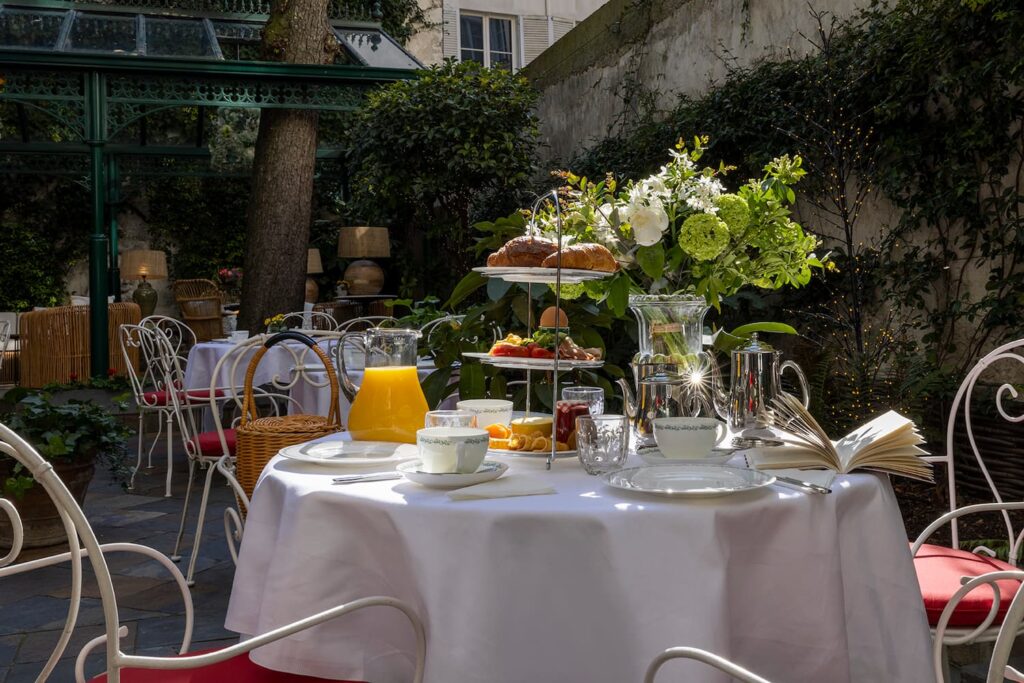 afternoon tea in Paris or breakfast in the garden - table with cups outside