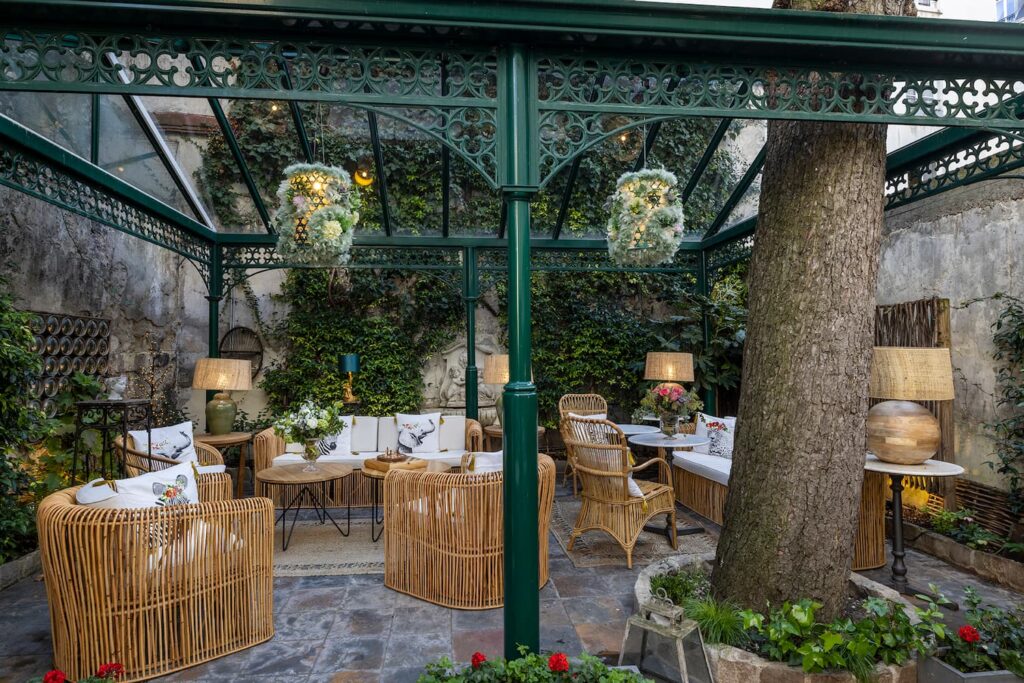 afternoon tea in Paris - table, sofa and armchairs outside in the garden